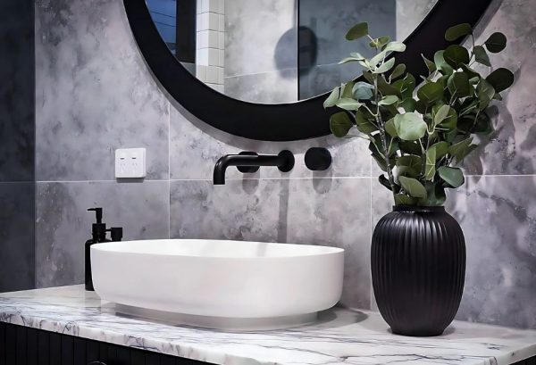 light-gray-aesthetic-bathroom-with-white-basin-black-tap-and-a-plant-in-a-black-vase